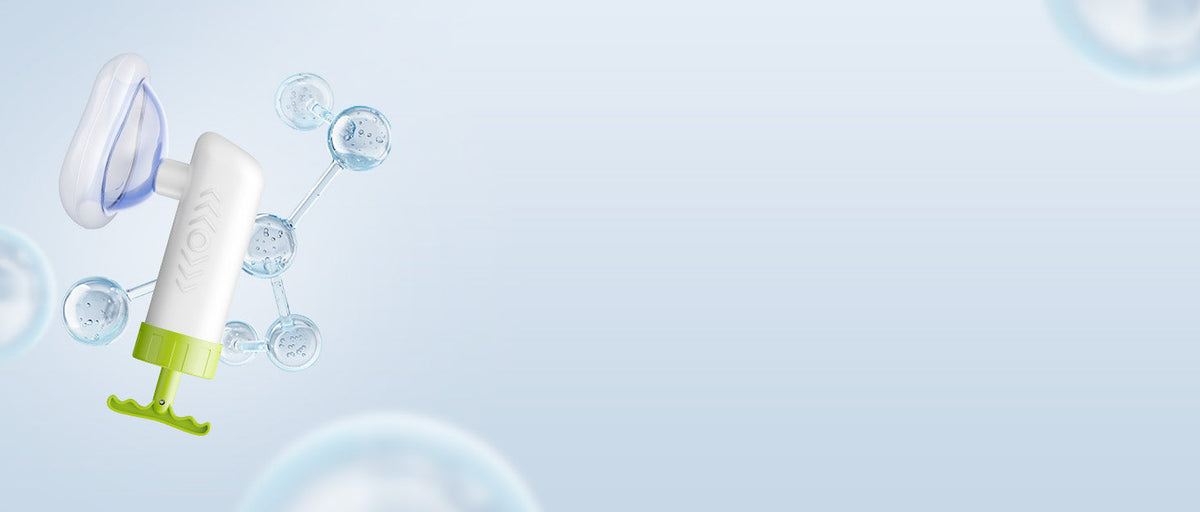 Mumany manual device in a wide pale blue product scene