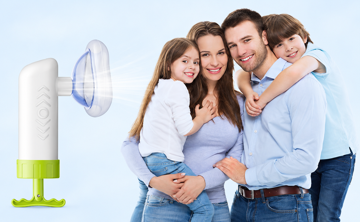 Family portrait beside a white and green Mumany manual device